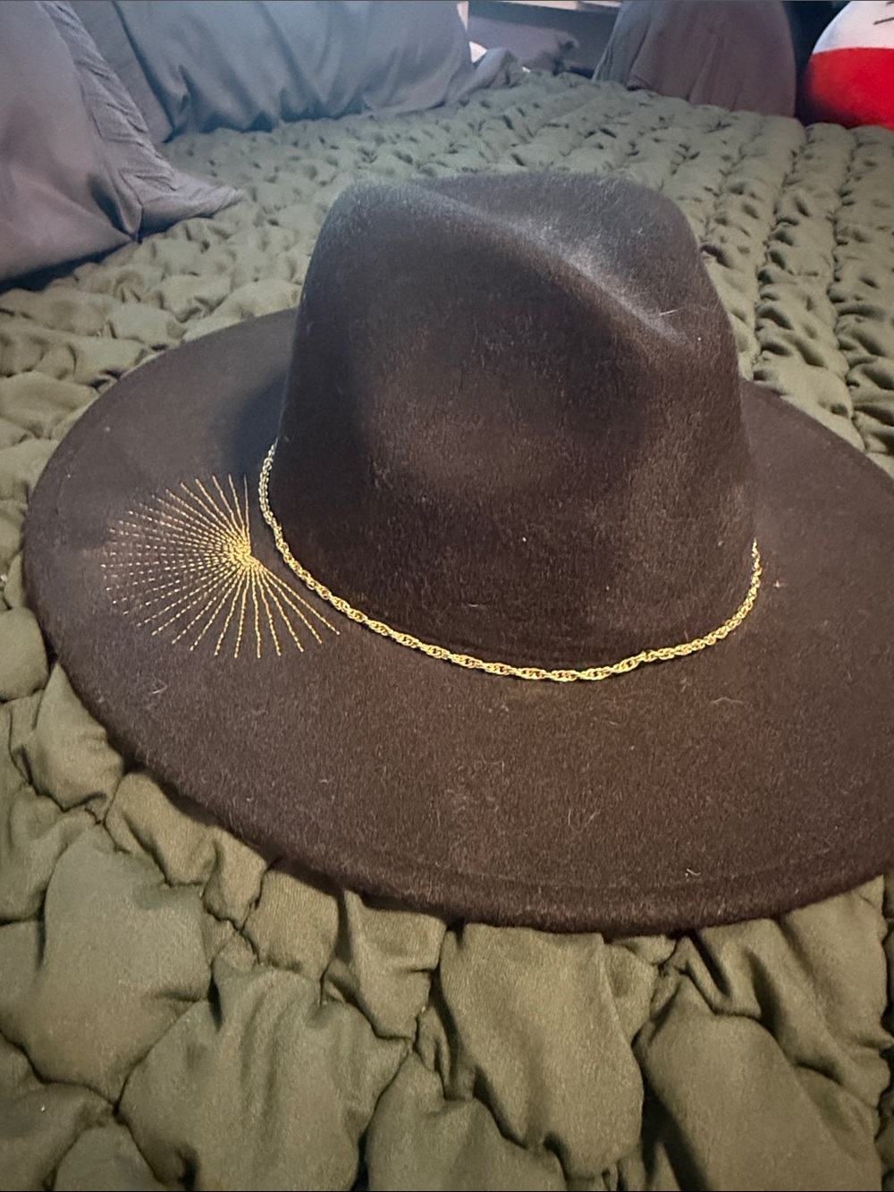 Elegant Black Wide-Brim Felt Hat with Gold Chain and Sunburst Detail